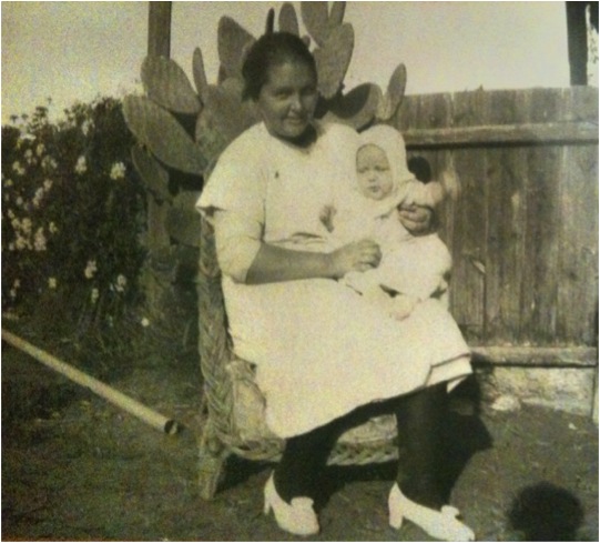 Belinda's grandmother as a baby, sitting on her mother's knee
